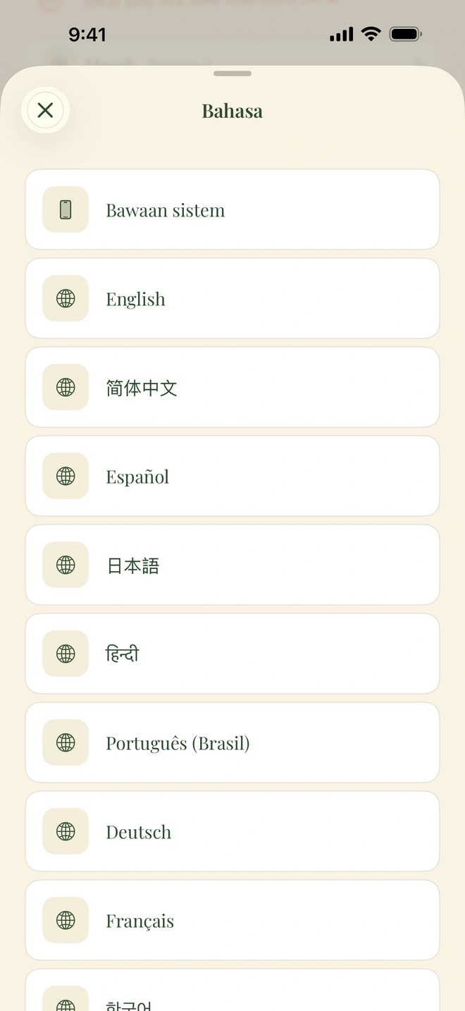 Pemilih bahasa dalam aplikasi menampilkan English, Español, فارسی, العربية, हिन्दी, dan 简体中文